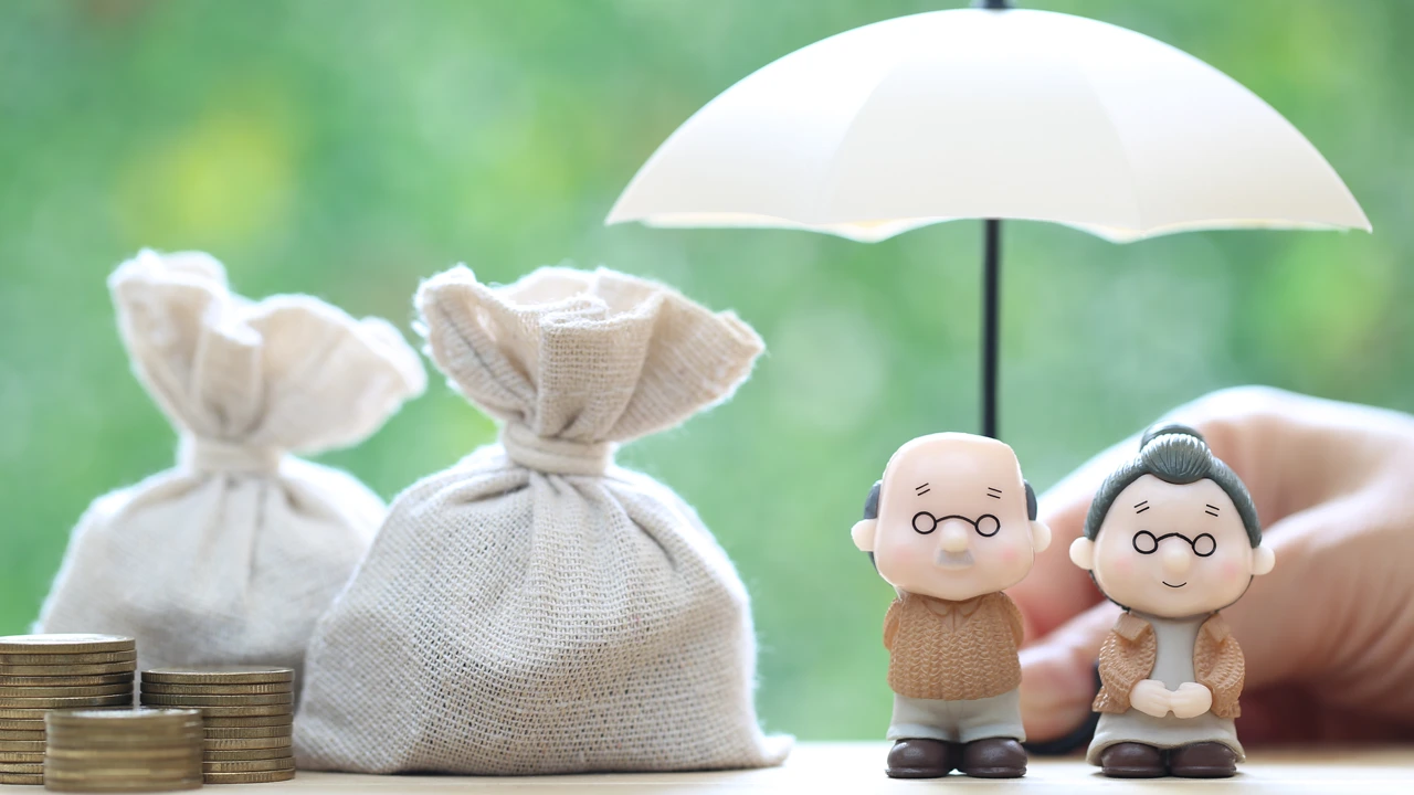 Illustration d'un couple agé protégé par un parapluie